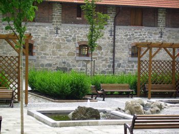 Spa guests can sip beer after soaking in it in this courtyard.