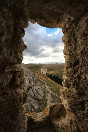 Not far from Castel Del Monte is a castle perched on the very top of what can only be described as a mountain. Beside that castle is a chapel. Photo by Adam Eagle.