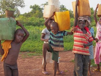 Kids in Mole with their water buckets.
