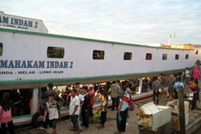 Boarding the longboat in Balikpapan, Borneo.