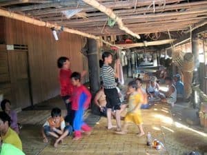 Borneo's Smoking Skulls and Sacrificial Swine 2 Kids playing in a longhouse in Borneo. S. Bedford photo.