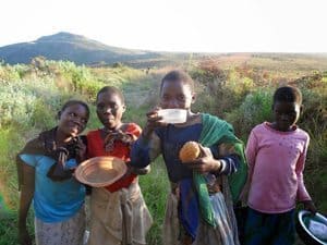 Malawi: Climbing the Biggest Mountain 5 The girls strike poses for the camera much to their amusement. They shrieked with laughter after seeing the photos and always wanted more.