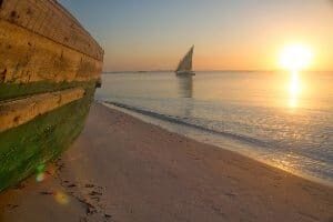 A fishing dhow returns to shore as the sun rises, Vilanculos. photos by Pip Strickland.