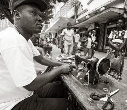 Mozambique: Traveling a Dangerous Road 13 A streetside tailor in Maputo.