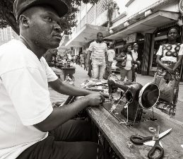 A streetside tailor in Maputo.