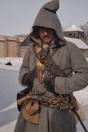 A costumed voyageur, French fur trappers who settled Winnipeg.