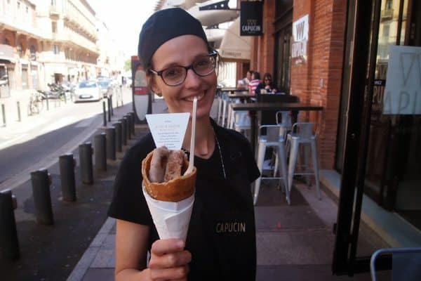 A server with cones of fois gras and other speciaties at Capucin Signe Bras in Toulouse.