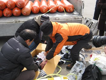 A Socks Drop on North Korea 3 Boxes are filled with colorful socks, to be shared by the lucky finders in North Korea.