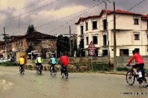 Biking through Korce in the rain.