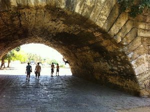 Climbing on bridge over Guadalquivir in Seville. Boys will be boys.
