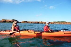 Sea kayaking in Pleasure Bay, Magdalen Islands.