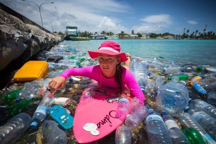 Maldives: Cleaning up Paradise 7 Alison displays her dissaproval at all of the plastic bottles in the water.