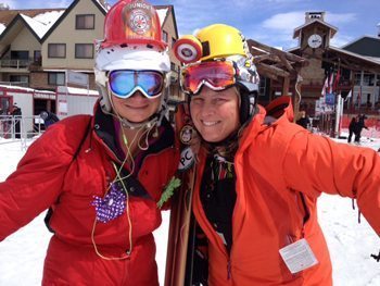 The heat is on! Two girls dressed like firemen chase a white-hot day of spring skiing in Park City, Utah.