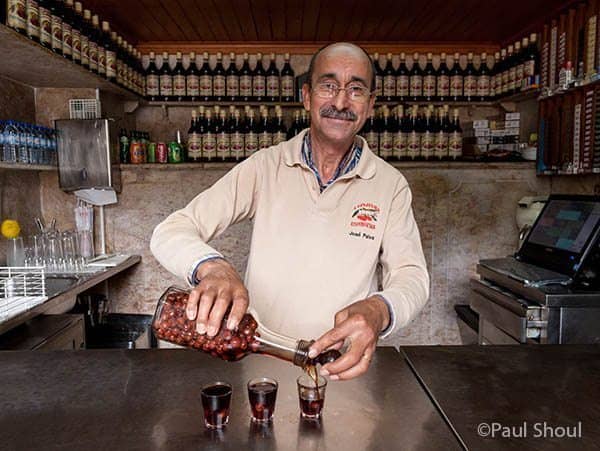 When traveling to Lisbon, a pilgrimage to Cafe A Ginjinha Espinheira Rossio is mandatory. A small closet sized bar with only room enough for three people, they serve one drink, the Ginja. Paul Shoul photo.