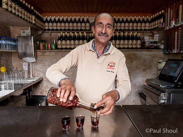 Portugal, Highlights of Lisbon, on Europe's Edge 1 When traveling to Lisbon, a pilgrimage to Cafe A Ginjinha Espinheira Rossio is mandatory. A small closet sized bar with only room enough for three people, they serve one drink, the Ginja. Paul Shoul photo.