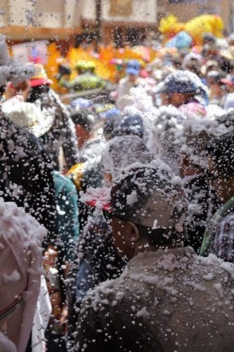 A talc and carioca foam fight in the Great Parade.