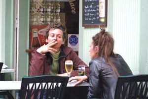 Smokers are easy to find in French cafes.