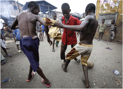 Lagos Nigeria: Navigating a Megacity 4 Boys playing in a Lagos neighborhood.