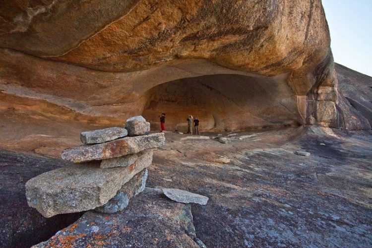 Outside a cave with ancient paintings in Zimbabwe. Rene Bauer photo.