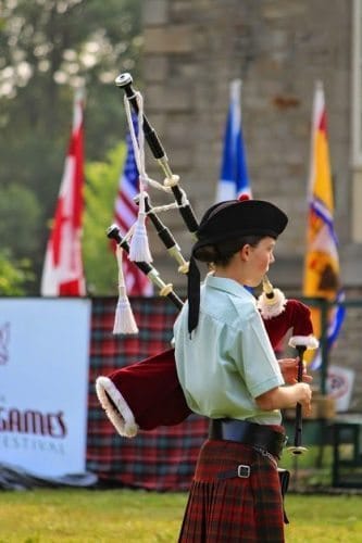 Bagpiper playing at the highland festival.