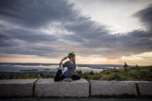 Experiencing Acadia National Park, Together Bri doing yoga early in the morning.