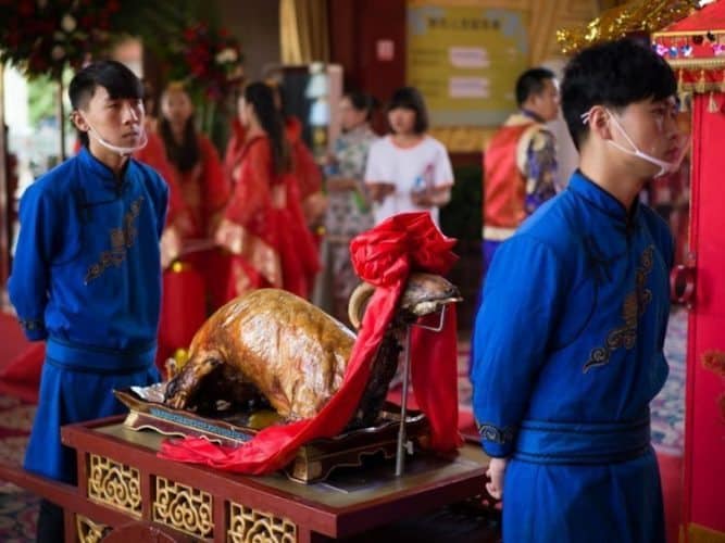 Westerners at a Chinese Wedding: Inner Mongolia 7 The roast sheep arrives. Photo by James Pope.
