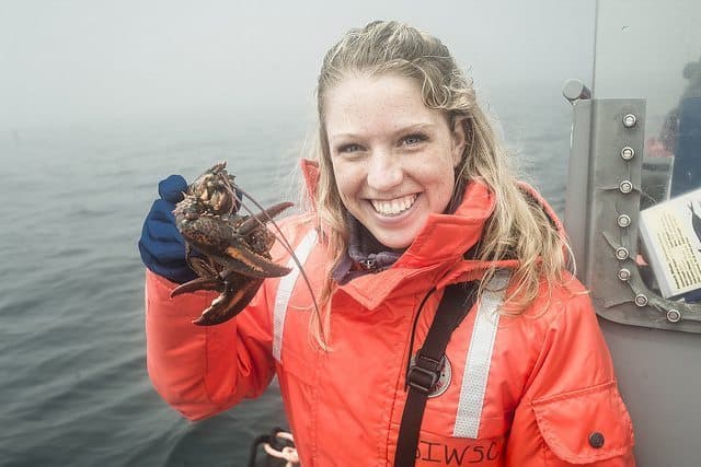 Bri holding a lobster during the whale watch.