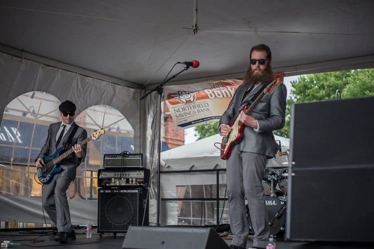 Musicians perform on Church Street despite bad weather.