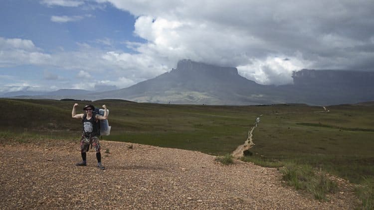 Posing in front of distant mountains.