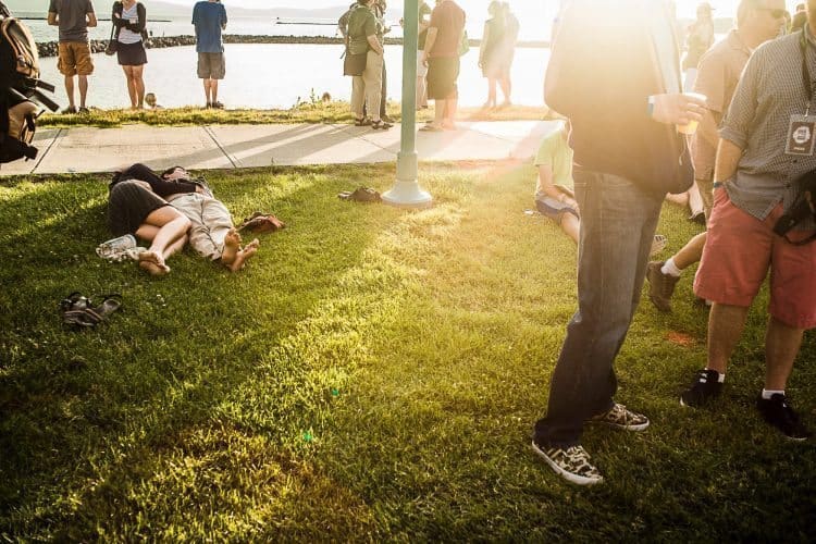 A couple embraces during a concert at the waterfront stage.