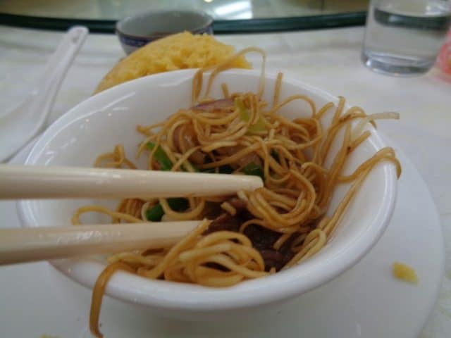 Close up of breakfast beef and egg noodles on the breakfast table.