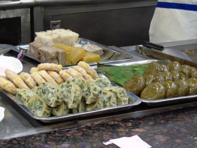 A fresh plate of jiaozi (front left), sweetcorn pancakes (back left) and green tea pancakes (right).