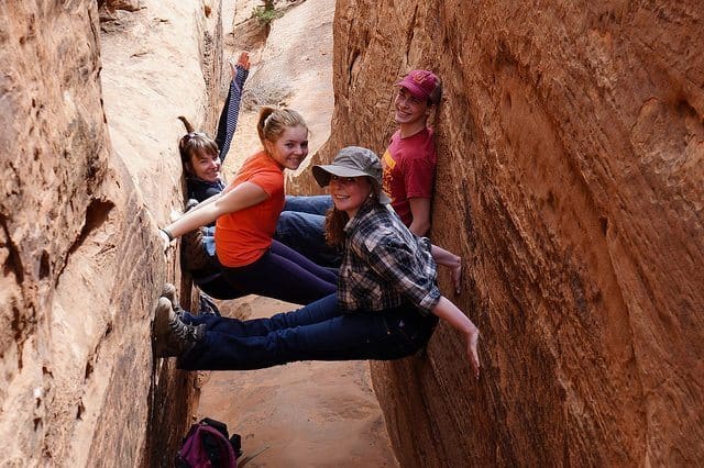 Melissa, Jack, Bridget, and Maisie Schwartz pose in a slot canyon along the Devil's Garden trail in Arches National Park
