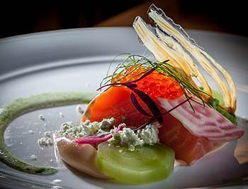 Smor- Salmon in salt and sugar water, Salmon roe, pickled cucumber, mustard seeds and red onion, Sour cream sauce with dill oil.
