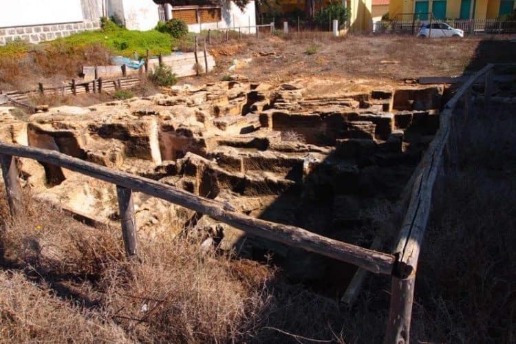 A necropolis on the Sinis Peninsula right next to seaside homes in a small village.