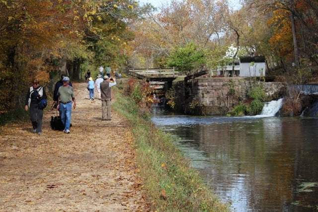 Visitors walking along the river on the Maryland side among the abundance of colorful leaves.