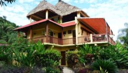 Guests of Sleeping Giant Rainforest Lodge can enjoy alfresco lunch overlooking colorful jungle gardens and dinner under a canopy of stars.