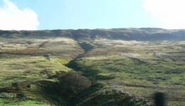 Distant mountains form the border of the horizon in Southern Wales.