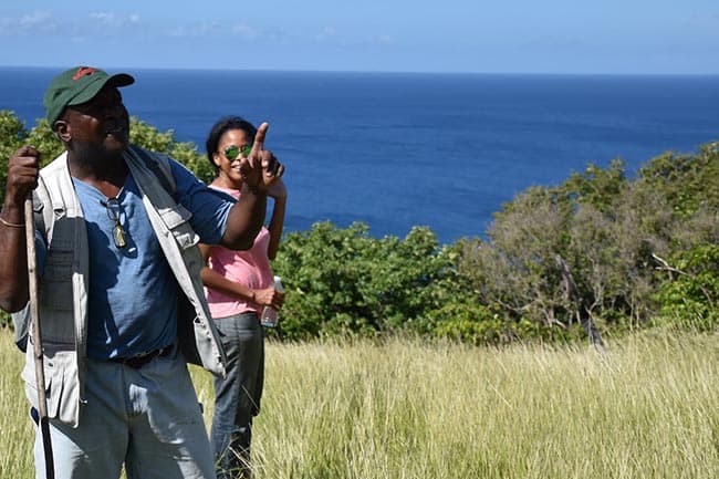 Scriber, a local guide, showing off local bird life on Monserrat.