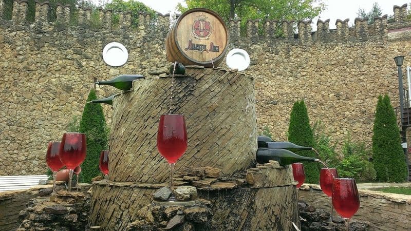 A Mliestii Mici entrance display barrel pouring into glasses. 