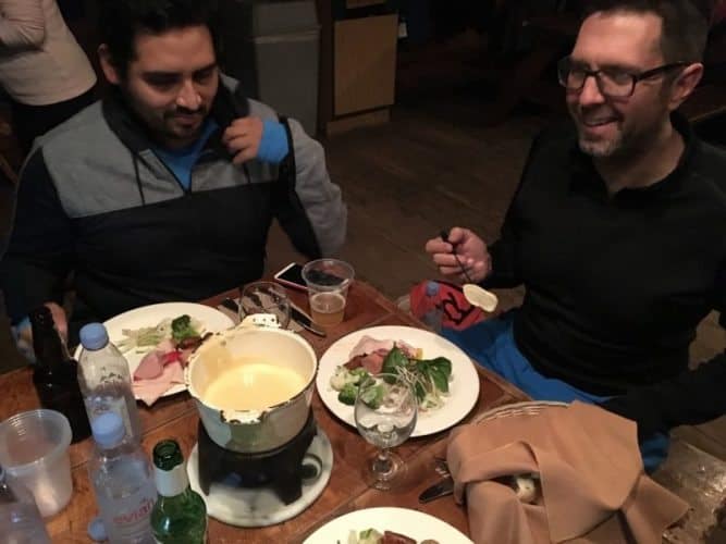 Enjoying traditional cheese fondue atop the mountain in the Relais des Trappeurs.