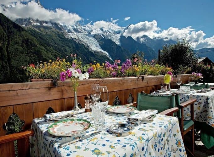 Dining in Chamonix France overlooking a glacier on Mt Blanc. Read about this great destination for winter and summer fun in the French Alps.