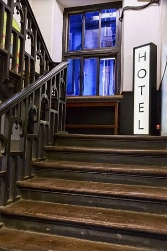 old wooden staircase leading to reception