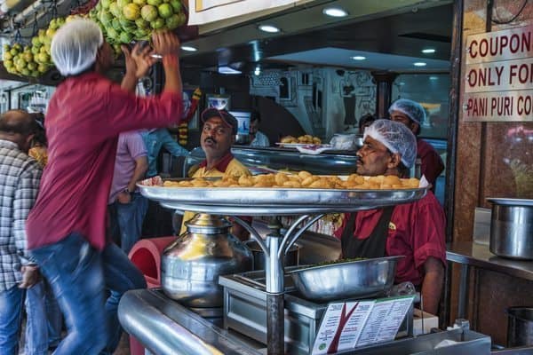 Chatting with vendors at their stall in Mumbai. 