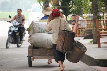 A motorbike travels through Hanoi.