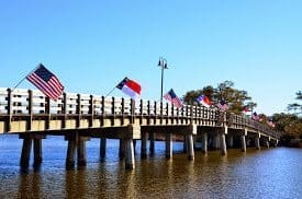 Flags of many nations on the wharf where the Starry Night is docked in North Carolina.