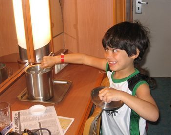 Kids help themselves in a cozy cruiseline cabin. Photos by Kate Hartshorne.