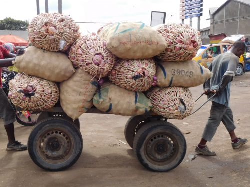 Hard work in the market in the intense African heat.