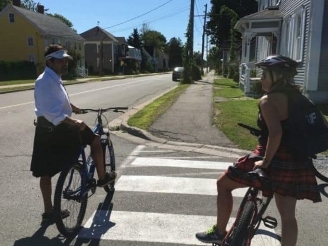 Biking the streets of St Andrews in kilts with Off Kilter Bike Tours.
