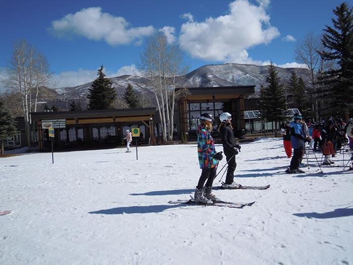 Ski School gathering place in front of Inn At Aspen